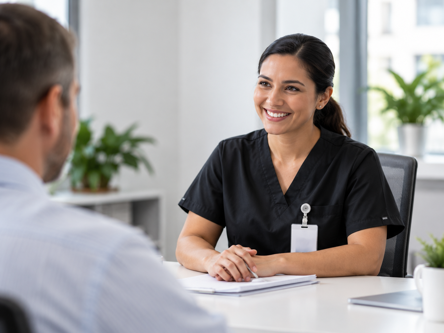 Healthcare professional speaking with a patient